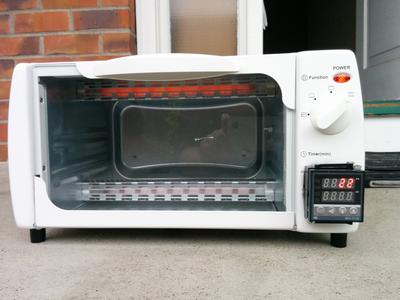 A toaster oven modified to lightly toast printed circuit boards