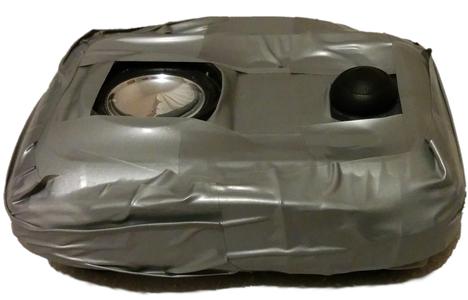 The first iteration of the device, with button, speaker, and duct tape visible